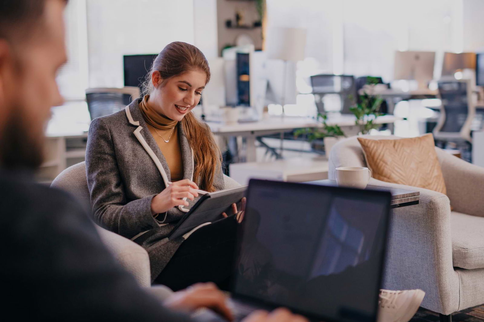 People in a meeting on laptops