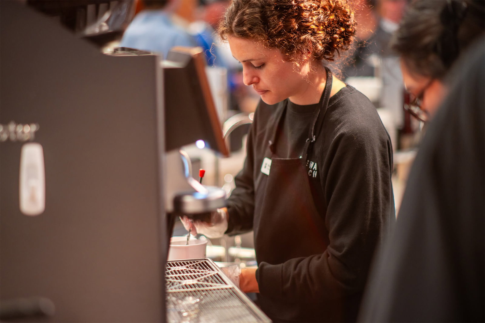 Woman making a hot coffee